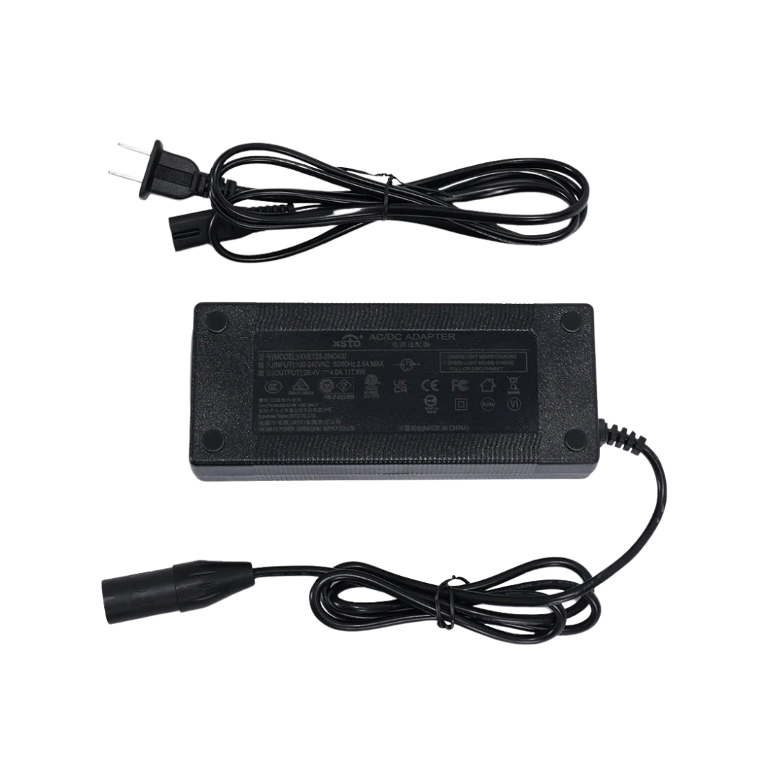 The XSTO Battery Charger for M4 Powerchair is a black 24V charger with a detachable power cord, labeled with technical details, and includes an output cable featuring a round plug.